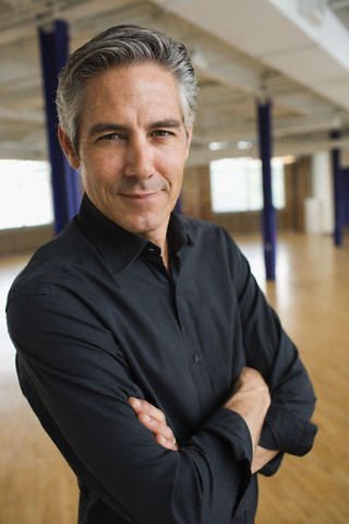 Businessman Standing in Loft